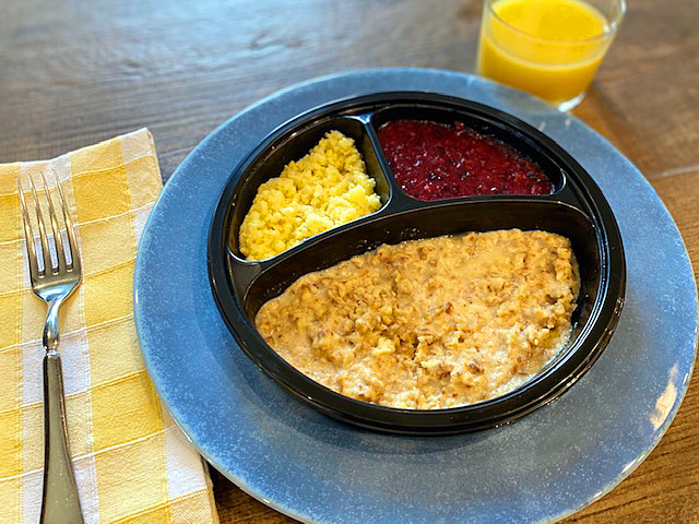 french toast,  eggs and berries